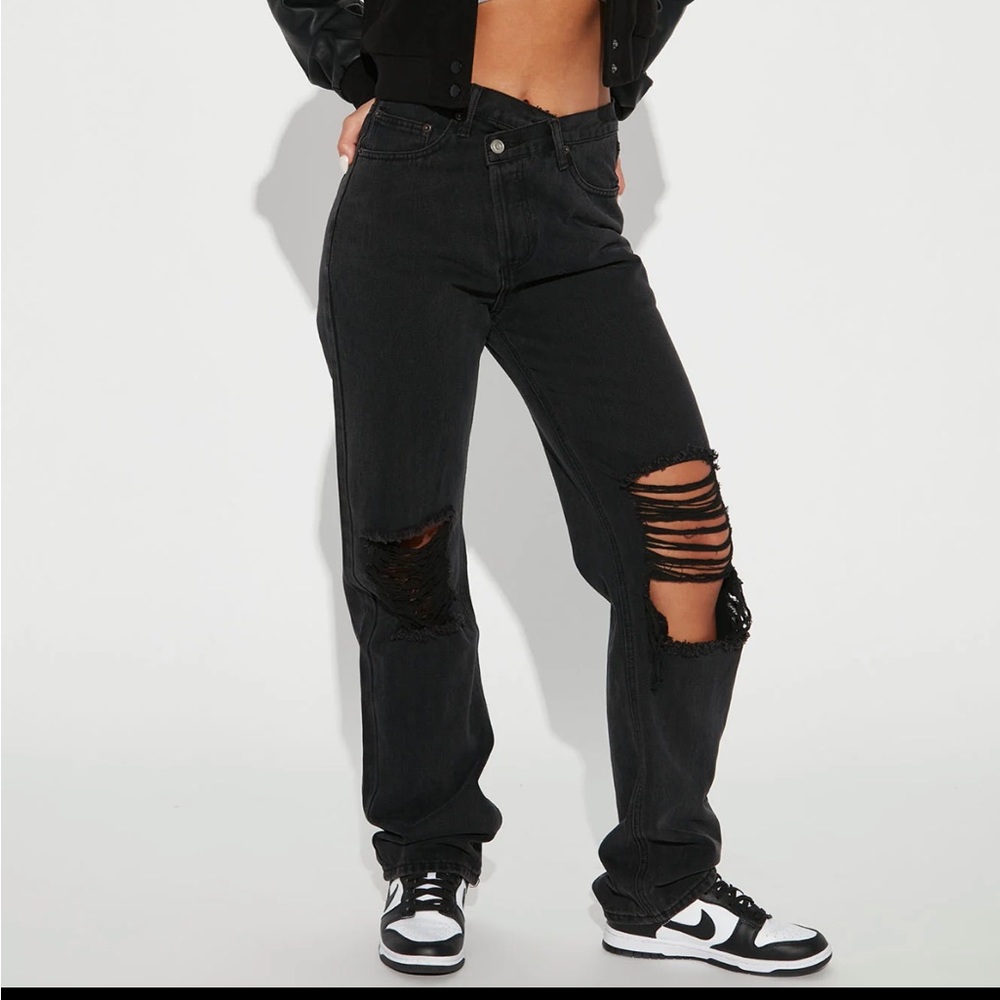 Distressed crossover jeans